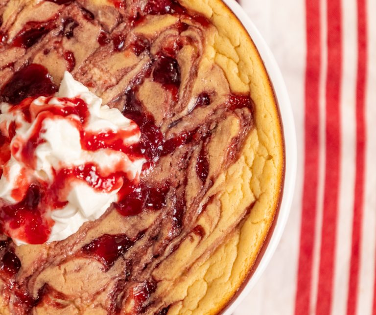 A white pan of raspberry cheesecake
