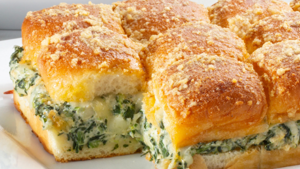 Slider buns with spinach and artichoke dip filling