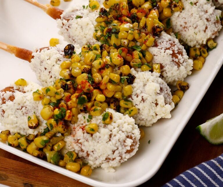 Street corn style corn dogs on a plate